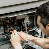 A man checking electrics