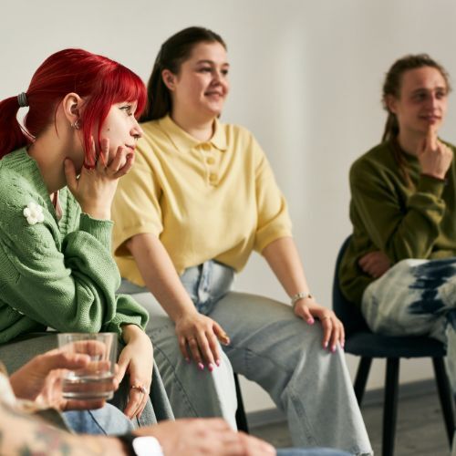 Three people chatting