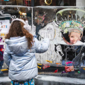 Child looks at ice sculpture