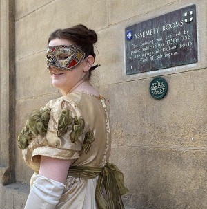 Photo of woman in mask outside York Assembly Rooms