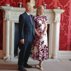 Photo of couple next to fireplace in Drawing Room during wedding ceremony