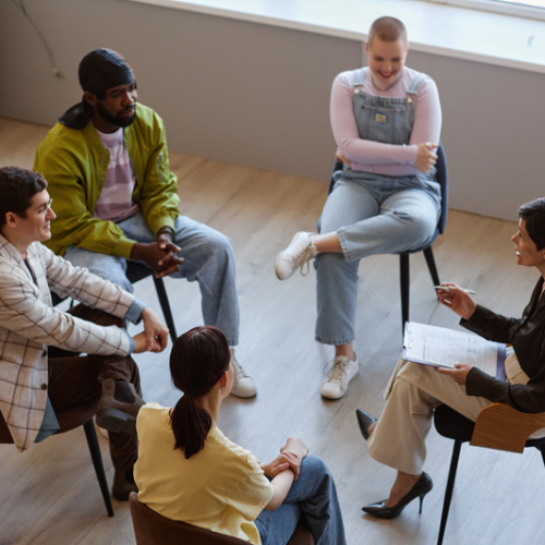 A group of seated people talking