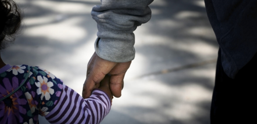 Two people holding hands