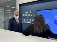 Acting Assistant Secretary Andrew Gradison listening to a representative from NCMEC share about their work.