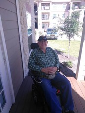 Mark outside using his wheelchair