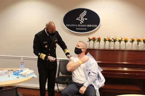 ACL Administrator Lance Robertson gets a flu shot from the Surgeon General