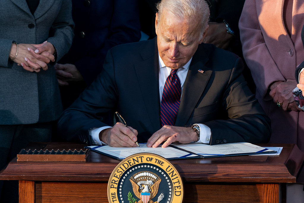 Biden signing Infrastructure bill. 