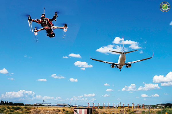 Aircraft and drone in flight