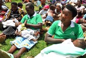 Women in Bulambira, Uganda participate in breastfeeding attachment competition