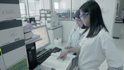 A researcher examines safe medicines.