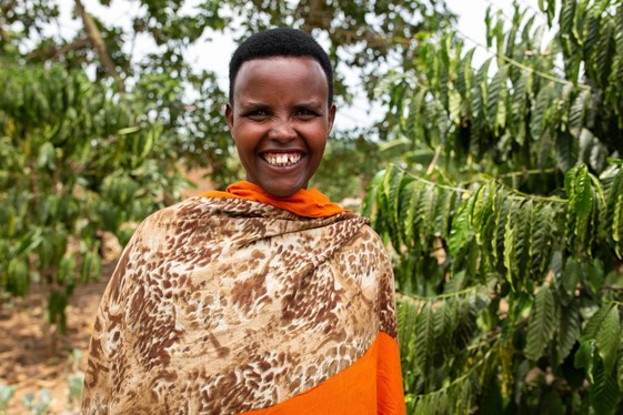 photograph of woman smiling by Carielle Doe for USAID