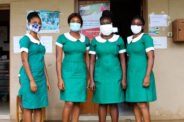 Henrietta Appiah and her team of nurses wearing face masks at the Mampong Urban CHPS facility.