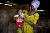 Rahama, 30, plays with her 9-month-old daughter, Maradiatu, inside their home in Sijri Veng Veng Village, Ghana. 