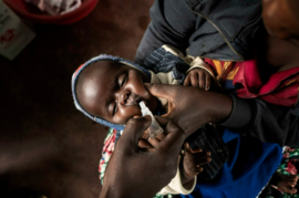 a newborn receives a vaccine