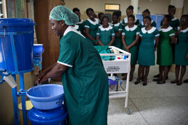 Health worker washing hands
