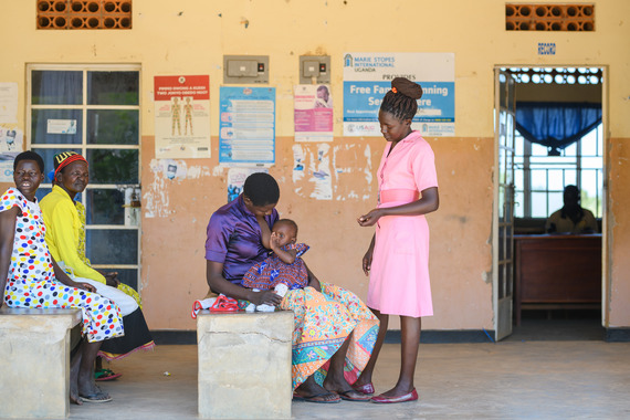 health worker supporting mother with breastfeeding