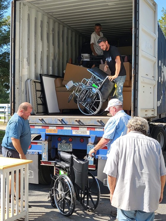 HealeyIRF staff load wheelchairs made available through LEPP  to ship to Sierra Leone. 