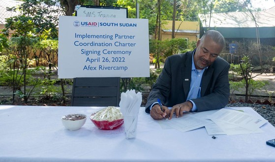 USAID/South Sudan Mission Director Haven Cruz-Hubbard signs the Implementing Partners’ Coordination Charter.