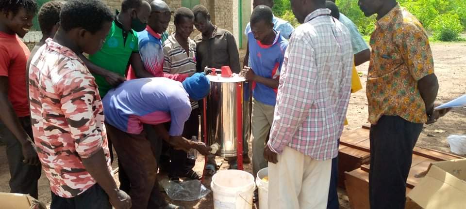 Beekeepers process honey. Photo: Sustainable Agriculture for Economic Resiliency (SAFER)