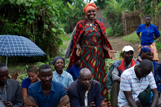 A woman facilitates a community meeting in Kejevuba, Rwanda. © Perry Bindelglass for Spark Microgrants