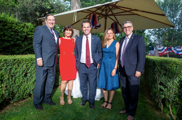 Director Phillips stands with colleagues at the Wilton Park event