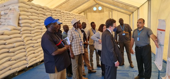 U.S. Ambassador Michael Adler (center) and USAID staff visited the World Food Program warehouse in Malakal on October 6. Photo: James Arike/USAID