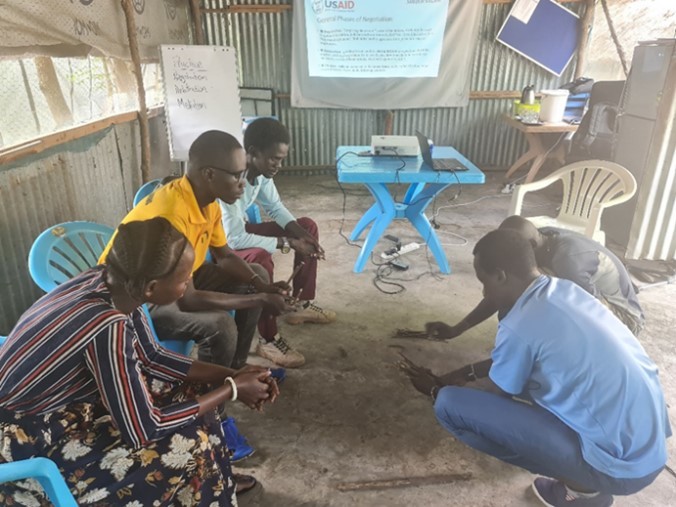 Gender Engagement Call team practicing conflict resolution during a training session. Photo: David Otim, Shejeh Salam activity