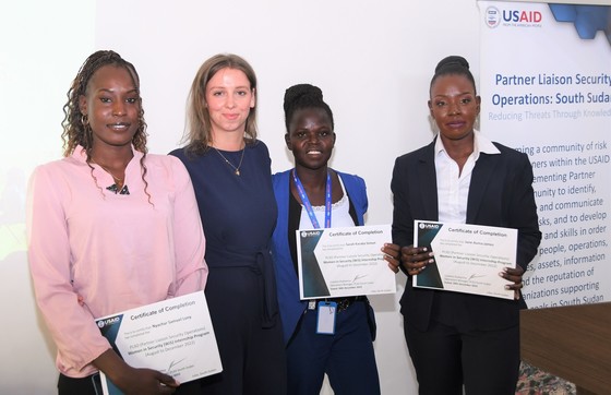 Three Women in Security interns who graduated with Veronika Polger (center), the PLSO Deputy Operations Manager