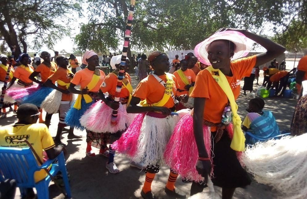 Women in Koch peace committee perform dances to mark Human Rights Day