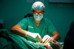 CURE doctor in operating room.