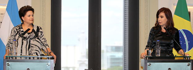 At left, Dilma Rousseff, Brazil’s first female president, speaks with the second female president of Argentina, Cristina Fernández de Kirchner.