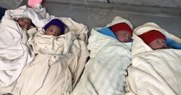 TWO SETS OF TWINS BORN WITHIN MINUTES OF EACH OTHER AT SCH. 