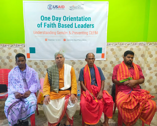 Four faith leaders sit together during the orientation  