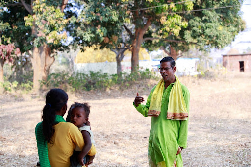 Faith leader speaks to community member during training 