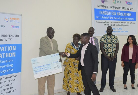 Charles Wote of Eye Radio receives a small grant at the Innovation Hackathon
