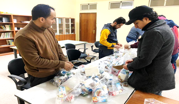 PLAY Youth Club members prepare Iftar meals.