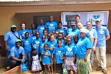 HEALEYIRF TEAM MEMBERS VISITING THE NEWTON INTERIM CARE CENTER IN SIERRA LEONE DURING THE EBOLA VIRUS EPIDEMIC.