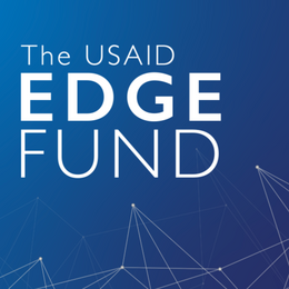 White text reading "The USAID EDGE Fund" on a blue gradient geometric background. 