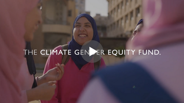 Screenshot of video. Several women laugh while the words "The Climate Gender Equity Fund" appear over top of the picture.