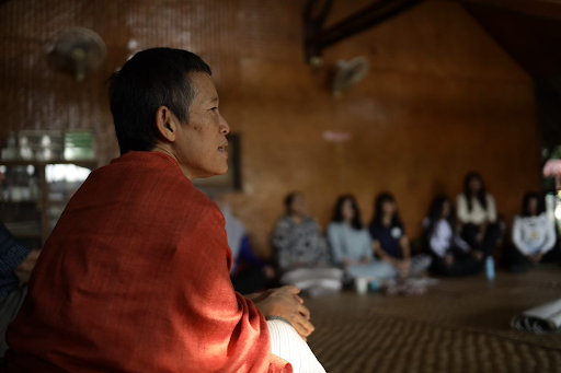  A facilitator engages in discussion during training session with female peacebuilders. 