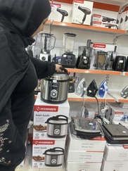 A woman shops for energy effecient appliance in Tripoli.