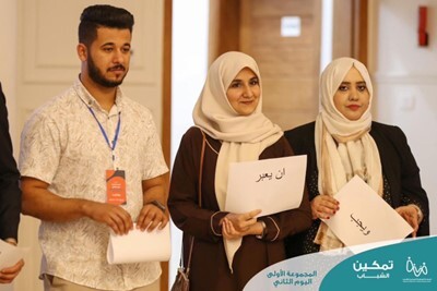 Takwa Sultan presents with other participants during a National Youth Academy activity. 