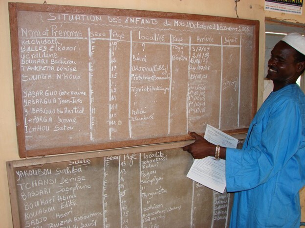 Educator Jean Djabo Biaou keeps a record of children rescued from child trafficking