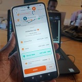Image of the Safeboda app where a user requests an electric motorcycle taxi provided by Zembo. Credit: Safeboda