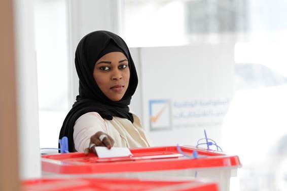 A Libyan woman at the ballot box.