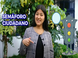 woman talking to the camera and next to her an animation of a traffic light