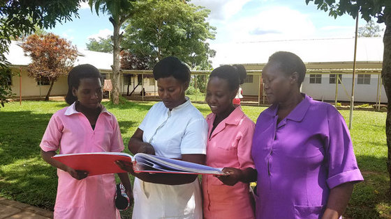 Midwives review HMIS data in Buikwe District, Uganda