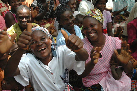 Women Cheering the Announcement of PMI in Mozambique