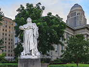 Image of a statue of a lion and french kings in Louisville.