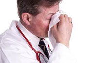 Doctor Holding Nose With Tissue